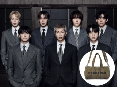 hybe faces criticism over bts it s not a bomb merchandise amid global war tensions