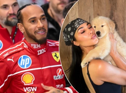 kim kardashian cuddles up to lewis hamilton s new puppy in latest instagram post kim kardashian cuddles up to lewis hamilton s new puppy in latest instagram post
