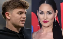 nikki bella reported to be casually dating eagles player cooper dejean while remaining single