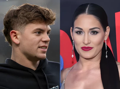 nikki bella reported to be casually dating eagles player cooper dejean while remaining single