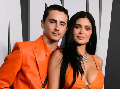 kylie jenner and timoth e chalamet rock matching orange looks at marty supreme la premiere