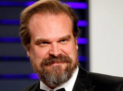 david harbour seen with mystery woman as stranger things cast attend maya hawke wedding