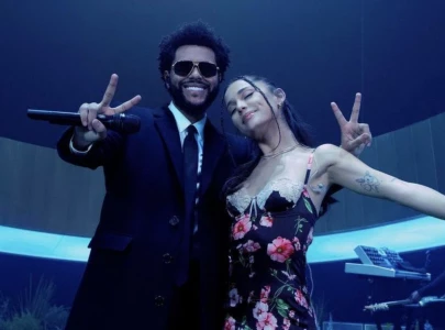 is the weeknd releasing a new song with ariana grande singer teases collaboration with cryptic post