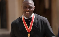 idris elba receives knighthood from king charles at windsor castle