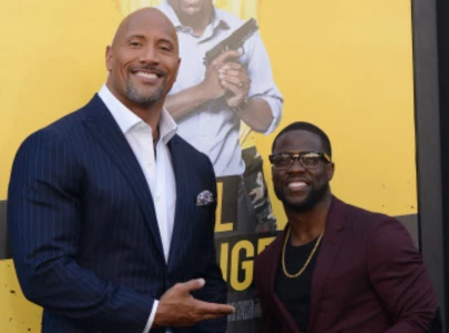 dwayne johnson takes playful swipe at kevin hart in behind the scene moment from jumanji 4 set