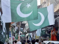 demand boom vendors display national flags and other independence day themed items for sale at stalls in the wholesale market in urdu bazaar rawalpindi photo agha mahroz express