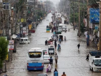 vehicles move along a flooded road following monsoon rains and rising water levels in sialkot punjab province pakistan august 27 2025 photo reuters