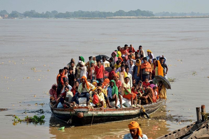 flood affected people are travelling to safe place in patna india photo afp