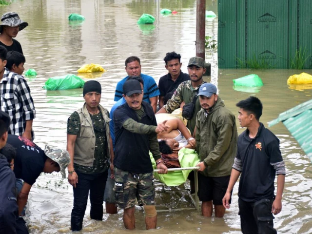 people carry a patient on a stretcher as they wait for a rescue boat to evacuate him from the flood affected jawaharlal nehru institute of medical sciences hospital following heavy rains in imphal east manipur india june 1 2025 photo reuters people carry a patient on a stretcher as they wait for a rescue boat to evacuate him from the flood affected jawaharlal nehru institute of medical sciences hospital following heavy rains in imphal east manipur india june 1 2025 photo reuters