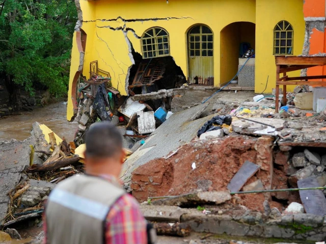 a man looks at a destroyed house as torrential rains from tropical storm raymond triggered landslides and flooding in jalcocotan nayarit state mexico october 12 2025 photo reuters a man looks at a destroyed house as torrential rains from tropical storm raymond triggered landslides and flooding in jalcocotan nayarit state mexico october 12 2025 photo reuters