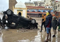 moroccans looks at a destroyed vehicle and other debris following a flash flood in the coastal town of safi some 300 kilometres south of the capital rabat on december 15 2025 photo afp moroccans looks at a destroyed vehicle and other debris following a flash flood in the coastal town of safi some 300 kilometres south of the capital rabat on december 15 2025 photo afp