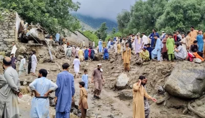 people gather at the site of a flash flood in pakistan s bajaur district photo afp