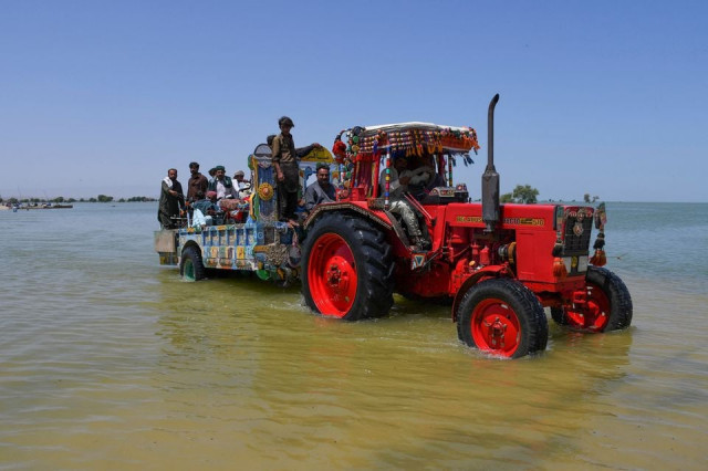 villagers board a tractor trolley as they travel amid flood water following rains and floods during the monsoon season in bajara village sehwan pakistan august 31 2022 photo reuters villagers board a tractor trolley as they travel amid flood water following rains and floods during the monsoon season in bajara village sehwan pakistan august 31 2022 photo reuters