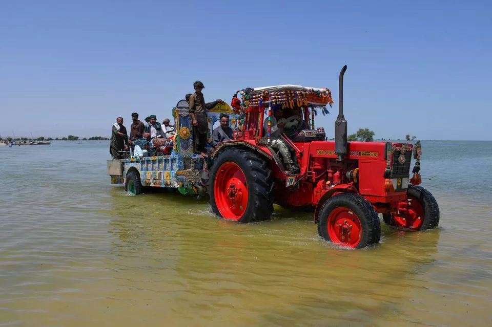 villagers board a tractor trolley as they travel amid flood water following rains and floods during the monsoon season in bajara village sehwan pakistan august 31 2022 photo reuters villagers board a tractor trolley as they travel amid flood water following rains and floods during the monsoon season in bajara village sehwan pakistan august 31 2022 photo reuters
