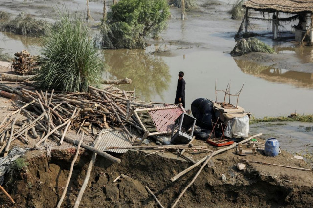 a flood victim stands amid the damages of his house following rains and floods during the monsoon season in nowshera pakistan august 31 2022 photo reuters a flood victim stands amid the damages of his house following rains and floods during the monsoon season in nowshera pakistan august 31 2022 photo reuters
