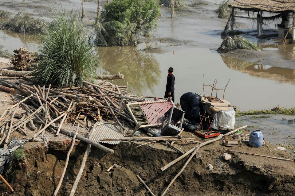a flood victim stands amid the damages of his house following rains and floods during the monsoon season in nowshera pakistan august 31 2022 photo reuters