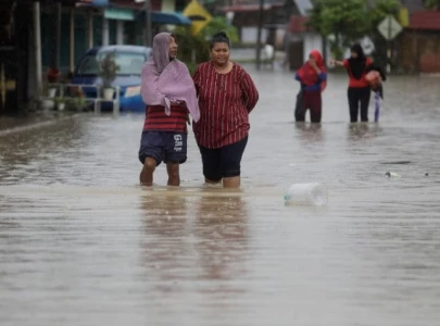 flooding in southern malaysia forces 40 000 people to flee homes