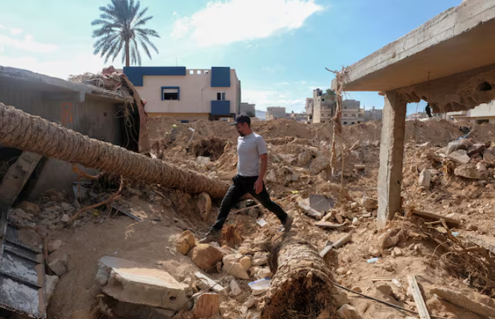 abdul salam ibrahim al qadi 43 years old walks on the rubble in front of his house searching for his missing father and brother after the deadly floods in derna libya september 28 2023 photo reuters