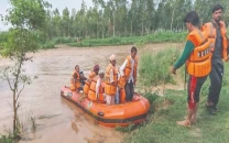 rescue officials ferry stranded villagers to safety as floodwaters engulf low lying areas near narowal amid relentless monsoon rains sweeping across punjab photo online rescue officials ferry stranded villagers to safety as floodwaters engulf low lying areas near narowal amid relentless monsoon rains sweeping across punjab photo online