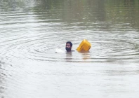 a farmer swims while using an empty canister through a flooded area near qasim bela village on the outskirts of multan photo reuters a farmer swims while using an empty canister through a flooded area near qasim bela village on the outskirts of multan photo reuters