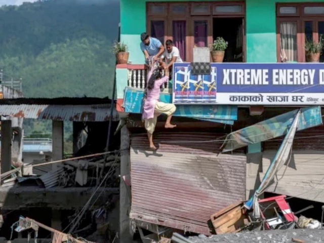 people try to enter their damaged house following deadly flash floods and mudslides in devighat nuwakot district nepal photo reuters people try to enter their damaged house following deadly flash floods and mudslides in devighat nuwakot district nepal photo reuters