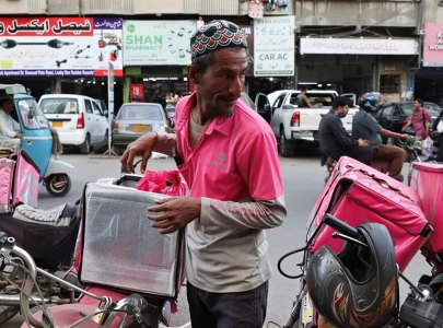 karachi s delivery riders race for eid but iran war squeezes earnings