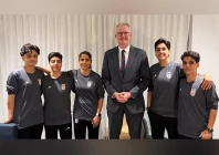 australia s minister for home affairs tony burke poses in an undisclosed location with five iranian women soccer players who have been granted asylum in australia on mar 10 2026 photo australia ministry of home affairs