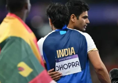 silver medallist india s neeraj chopra c front congratulates gold medallist pakistan s arshad nadeem after competing in the men s javelin throw final of the athletics event at the paris 2024 olympic games at stade de france in saint denis north of paris on 8 august 2024 photo afp