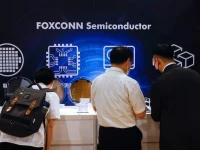 foxconn shareholders look at wafers on display after the annual shareholder meeting in new taipei city taiwan may 31 2023 reuters