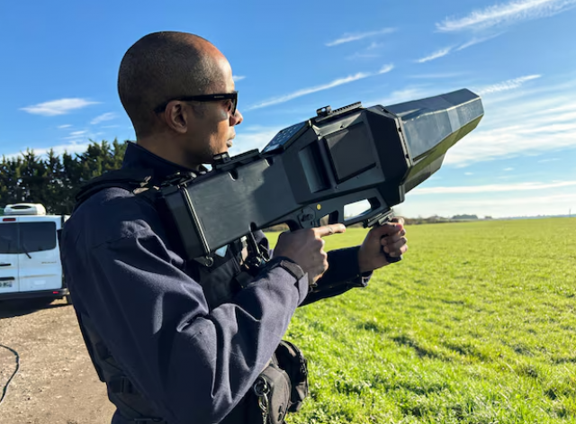 a french police officer poses with an anti drone rifle during an exercise to test out their anti drone defence equipment ahead of playing host to the summer olympics at the military airbase of villacoublay near paris france march 14 2024 photo reuters a french police officer poses with an anti drone rifle during an exercise to test out their anti drone defence equipment ahead of playing host to the summer olympics at the military airbase of villacoublay near paris france march 14 2024 photo reuters