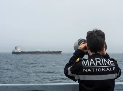france s macron says french navy boarded russia linked oil tanker