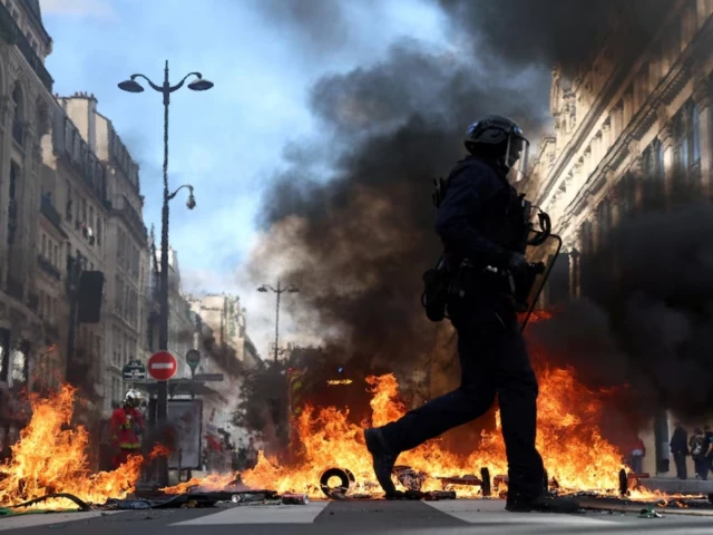 french riot police walk past burning objects in a street amid clashes with protesters in paris as part of nationwide protests against the cost of living and rising fuel prices called by the yellow vests movement joined by french high school and university students teachers and parents demanding better school conditions and government action as well as labour unions workers farmers and retirees france october 17 2026 photo reuters french riot police walk past burning objects in a street amid clashes with protesters in paris as part of nationwide protests against the cost of living and rising fuel prices called by the yellow vests movement joined by french high school and university students teachers and parents demanding better school conditions and government action as well as labour unions workers farmers and retirees france october 17 2026 photo reuters