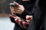 teenagers look at their mobile phone screens during an interview with reuters about the bill aimed at banning the use of social networks for those under 15 and mobile phones in high schools from the start of the 2026 school year in paris france february 20 2026 reuters