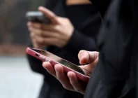 teenagers look at their mobile phone screens during an interview with reuters about the bill aimed at banning the use of social networks for those under 15 and mobile phones in high schools from the start of the 2026 school year in paris france february 20 2026 reuters