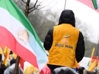 a supporter of the national council of resistance of iran waves an iran s flag as he takes part in a demonstration in support of the iranian people s uprising for democracy and freedom in brussels on january 9 2026 iran s supreme leader ayatollah ali khamenei on january 9 2026 insisted that the islamic republic would not back down in the face of protests after the biggest rallies yet in an almost two week movement sparked by anger over the rising cost of living photo afp