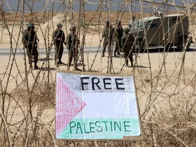 a sign placed by left wing israeli activists hang along the border with the gaza strip after a protest calling for an end to the war between israel and hamas on september 19 2025 in southern israel photo afp file
