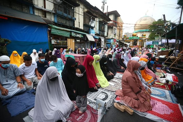 Filipino Muslims offer prayers to mark Eidul Azha outside a mosque in Manila City, suburban Manila on July 20, 2021. PHOTO: AFP