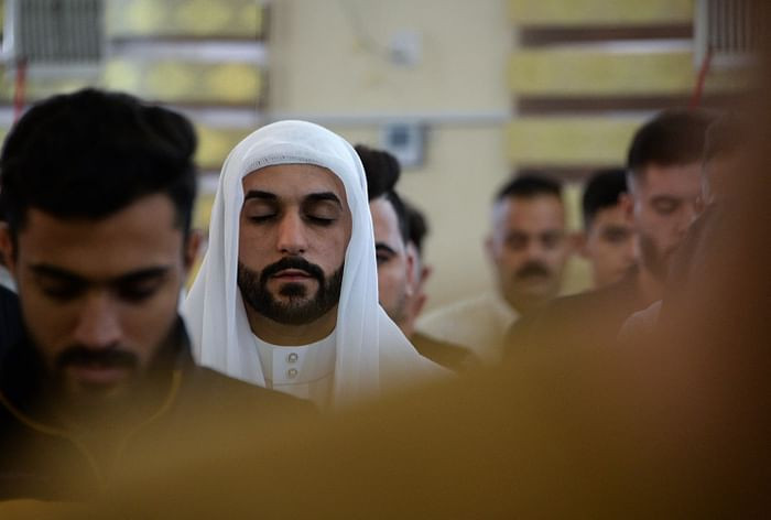 Iraqi worshippers perform the Eidul Azha prayers on the first day of the feast celebrated by Muslims worldwide, at the Mohammed Alamine mosque in the northern city of Mosul, on July 20, 2021. PHOTO: AFP