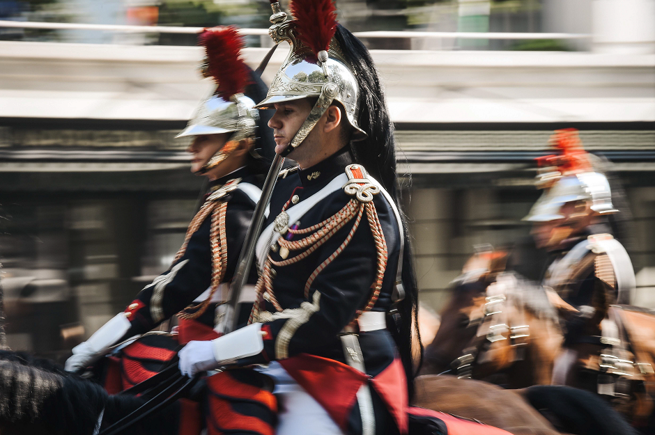 French Republican Guards arrive on horseback. PHOTO: AFP.