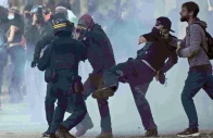 protesters scuffle with gendarmes as they take part in a demonstration to protest against the high cost of living in nantes france photo afp