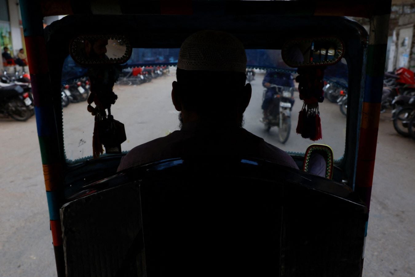 Amesh Gul, 32, a motorised auto-rickshaw driver, drives along a street amid rising fuel and liquefied petroleum gas (LPG) prices due to the Iran conflict, in Karachi, Pakistan, September 16, 2026. REUTERS