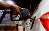 a worker holds a fuel nozzle to fills fuel in a car at petrol station in karachi on september 16 2023 photo reuters file