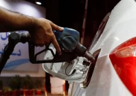 a worker holds a fuel nozzle to fills fuel in a car at petrol station in karachi on september 16 2023 photo reuters file