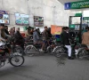 people wait for their turn to get fuel at a petrol station in peshawar on january 30 2023 photo reuters file