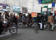 people wait for their turn to get fuel at a petrol station in peshawar on january 30 2023 photo reuters file
