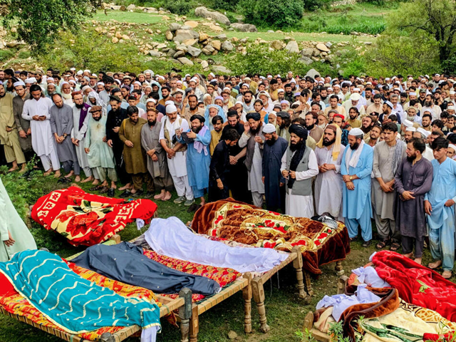 Mourners offer funeral prayers for flood victims in Pakistan's Bajaur district. Photo: AFP