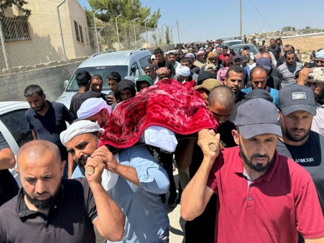 mourners carry the body of well known palestinian activist owdeh hathaleen who according to people who said they witnessed the shooting was shot and killed in the village of umm al khair by israeli settler last week during his funeral near the city of hebron in the israeli occupied west bank august 7 2025 photo reuters mourners carry the body of well known palestinian activist owdeh hathaleen who according to people who said they witnessed the shooting was shot and killed in the village of umm al khair by israeli settler last week during his funeral near the city of hebron in the israeli occupied west bank august 7 2025 photo reuters