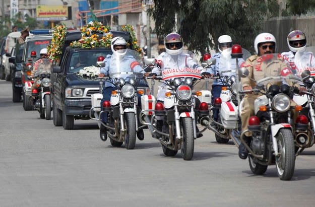 Pakistan's military, naval and air force police officers escort the hearse carrying the coffin of Dr Ruth Pfau. PHOTO: REUTERS