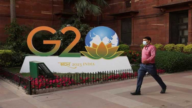 a man walks past a model of g20 logo outside the finance ministry in new delhi india march 1 2023 photo reuters file a man walks past a model of g20 logo outside the finance ministry in new delhi india march 1 2023 photo reuters file