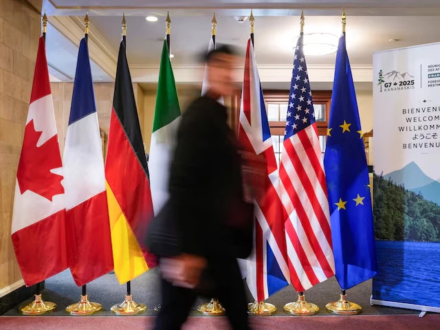 a man walk past the g7 members flags at the manoir richelieu before the g7 foreign ministers summit in la malbaie quebec canada march 12 2025 photo reuters a man walk past the g7 members flags at the manoir richelieu before the g7 foreign ministers summit in la malbaie quebec canada march 12 2025 photo reuters